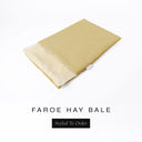 A folded spare dog bed cover to fit Charley Chau Snuggle Dog Beds and Dog Burrow Bags with warm straw yellow outer cover in woven wool texture upholstery-quality Faroe and plush cream faux-fur lining on a white backdrop.