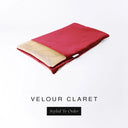 A folded spare dog bed cover to fit Charley Chau Snuggle Dog Beds and Dog Burrow Bags with red outer cover in upholstery-quality Velour and plush cream faux-fur lining on a white backdrop.