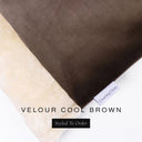 A close up detail of the corner of a Charley Chau Dog Snuggle Bed and dog Burrow Bag Dog Bed Cover with rich brown outer cover in upholstery-quality Velour and plush cream faux-fur lining with a woven brand label showing the Charley Chau logo on a white backdrop.