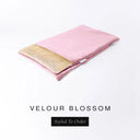 A folded spare dog bed cover to fit Charley Chau Snuggle Dog Beds and Dog Burrow Bags with pink outer cover in upholstery-quality Velour and plush cream faux-fur lining on a white backdrop.