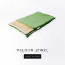 A folded spare dog bed cover to fit Charley Chau Snuggle Dog Beds and Dog Burrow Bags with emerald green outer cover in upholstery-quality Velour and plush cream faux-fur lining on a white backdrop.