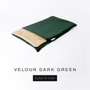A folded spare dog bed cover to fit Charley Chau Snuggle Dog Beds and Dog Burrow Bags with dark green outer cover in upholstery-quality Velour and plush cream faux-fur lining on a white backdrop.