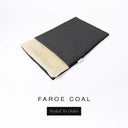 A folded spare dog bed cover to fit Charley Chau Snuggle Dog Beds and Dog Burrow Bags with charcoal black outer cover in woven wool texture upholstery-quality Faroe and plush cream faux-fur lining on a white backdrop.