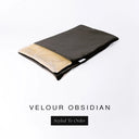 A folded spare dog bed cover to fit Charley Chau Snuggle Dog Beds and Dog Burrow Bags with black outer cover in upholstery-quality Velour and plush cream faux-fur lining on a white backdrop.