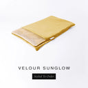 A folded spare dog bed cover to fit Charley Chau Snuggle Dog Beds and Dog Burrow Bags with golden yellow outer cover in upholstery-quality Velour and plush cream faux-fur lining on a white backdrop.
