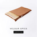 A folded spare dog bed cover to fit Charley Chau Snuggle Dog Beds and Dog Burrow Bags with burnt orange outer cover in upholstery-quality Velour and plush cream faux-fur lining on a white backdrop.