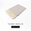 A folded spare dog bed cover to fit Charley Chau Snuggle Dog Beds and Dog Burrow Bags with pale beige outer cover in woven wool texture upholstery-quality Faroe and plush cream faux-fur lining on a white backdrop.