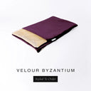 A folded spare dog bed cover to fit Charley Chau Snuggle Dog Beds and Dog Burrow Bags with deep purple outer cover in upholstery-quality Velour and plush cream faux-fur lining on a white backdrop.