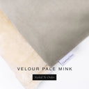 A close up detail of the corner of a Charley Chau Dog Snuggle Bed and dog Burrow Bag Dog Bed Cover with pale taupe outer cover in upholstery-quality Velour and plush cream faux-fur lining with a woven brand label showing the Charley Chau logo on a white backdrop.