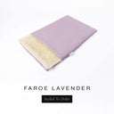A folded spare dog bed cover to fit Charley Chau Snuggle Dog Beds and Dog Burrow Bags with pale lilac outer cover in woven wool texture upholstery-quality Faroe and plush cream faux-fur lining on a white backdrop.