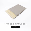 A folded spare dog bed cover to fit Charley Chau Snuggle Dog Beds and Dog Burrow Bags with pale taupe grey outer cover in woven wool texture upholstery-quality Faroe and plush cream faux-fur lining on a white backdrop.