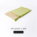 A folded spare dog bed cover to fit Charley Chau Snuggle Dog Beds and Dog Burrow Bags with lime green outer cover in upholstery-quality Velour and plush cream faux-fur lining on a white backdrop.
