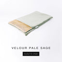 A folded spare dog bed cover to fit Charley Chau Snuggle Dog Beds and Dog Burrow Bags with pale sage green outer cover in upholstery-quality Velour and plush cream faux-fur lining on a white backdrop.