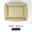 Top-down view of the Bliss Bolster Dog Bed in a warm golden oat 'HAY BALE' Faroe fabric, showing the raised sides and deep cushioned base of this long lasting dog bed with sides; a comfortable bolster dog bed and high-wall dog bed for everyday use.