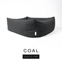 Close-up corner view of a dark charcoal black Bliss Bolster Dog Bed in 'COAL' Faroe fabric with a black 'Styled To Order' label, showing the tall walls of this long lasting dog bed with sides; a durable bolster dog bed and high-wall dog bed built to last.