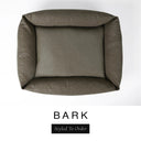 Top-down view of the Bliss Bolster Dog Bed in a deep olive brown 'BARK' Faroe fabric, showing the raised sides and deep cushioned base of this long lasting dog bed with sides; a comfortable bolster dog bed and high-wall dog bed for everyday use.