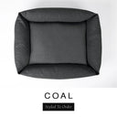 Top-down view of the Bliss Bolster Dog Bed in a dark charcoal black 'COAL' Faroe fabric, showing the raised sides and deep cushioned base of this long lasting dog bed with sides; a comfortable bolster dog bed and high-wall dog bed for everyday use.