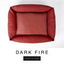 Top-down view of the Bliss Bolster Dog Bed in a deep rust red 'DARK FIRE' Faroe fabric, showing the raised sides and deep cushioned base of this long lasting dog bed with sides; a comfortable bolster dog bed and high-wall dog bed for everyday use.