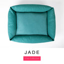 Top-down view of the Bliss Bolster Dog Bed in a deep teal green 'JADE' Faroe fabric, showing the raised sides and deep cushioned base of this long lasting dog bed with sides; a comfortable bolster dog bed and high-wall dog bed for everyday use.