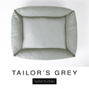 Top-down view of the Bliss Bolster Dog Bed in a classic mid grey 'TAILOR'S GREY' Faroe fabric, showing the raised sides and deep cushioned base of this long lasting dog bed with sides; a comfortable bolster dog bed and high-wall dog bed for everyday use.