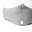 Close up detail shot of the corner of the luxury Bliss Bolster Dog Bed by Charley Chau showing the textre of the durable, hard-wearing upholstery fabric o nthe outer cover and a Charley chau brand label.