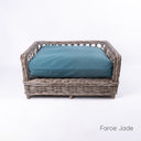 Charley Chau's stylish Raised Rattan Dog Bed with deep-filled luxury dog bed mattress in jade green on a white backdrop.