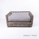 Charley Chau's stylish Raised Rattan Dog Bed with deep-filled luxury dog bed mattress in woven grey upholstery fabric on a white backdrop.