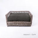 Charley Chau's stylish Raised Rattan Dog Bed with deep-filled luxury dog bed mattress in woven dark brown upholstery fabric on a white backdrop.