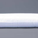Close up shot of a luxury Dog Travel Pad Mattress by Charley Chau on a grey backdrop.