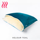 Charley Chau luxury dog snuggle bed designed for dogs to burrow under cover in a teal velvet with a cream-faux-fur fleece lining on a white backdrop.